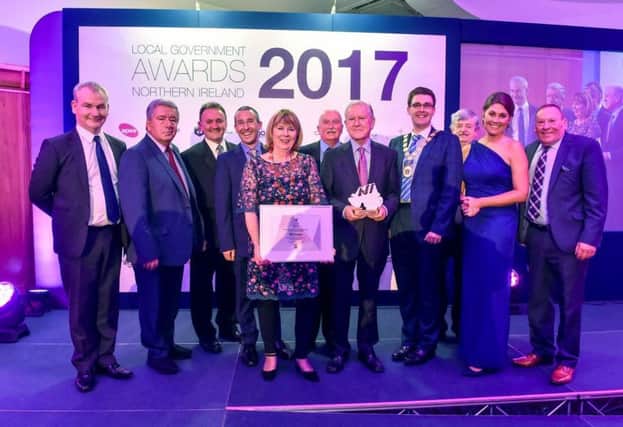 Alderman Deborah Girvan (centre) receives the award for 'Best Initiative by a Councillor' at the Northern Ireland Local Government Awards 2017. Also pictured are members of the CFM committee, Ards and North Down councillors and TV presenter Sarah Travers.