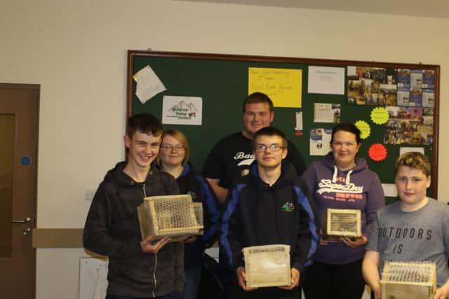 Mourne YFC members with their mini beast boxes that they built during the Grassroots Challenge