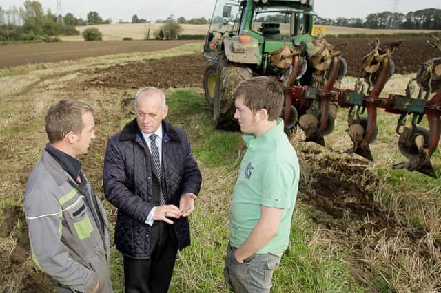 Group Manager Lawson Burnett with members discussing current farming conditions at a previous farm visit.