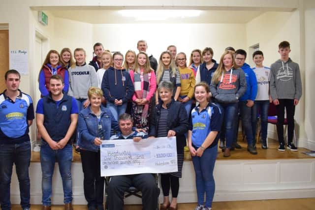 Holestone members presenting a cheque to Headway Ballymena at a recent club meeting